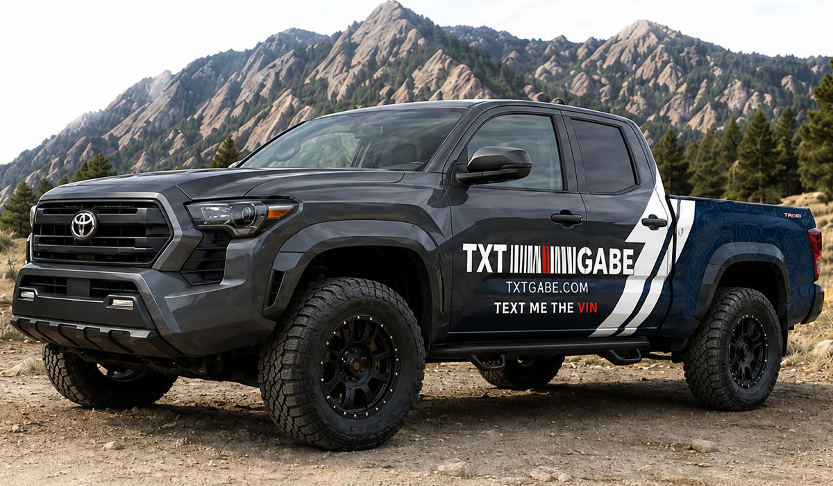 Toyota Tacoma truck with TXTGABE branding in Boulder Colorado mountains - Sell your vehicle fast